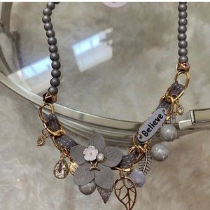 Very beautiful necklace with the words “Believe”